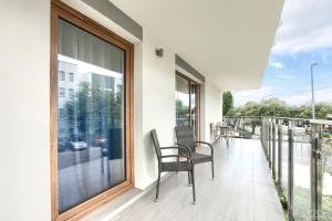 Balkón alebo terasa v ubytovaní Horyzont Apartamenty - Osiedle Bursztynowe