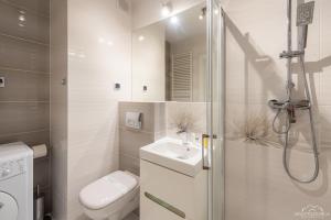 Kúpeľňa v ubytovaní Horyzont Apartamenty - Osiedle Bursztynowe