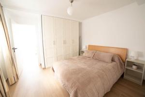 Posteľ alebo postele v izbe v ubytovaní ATICO CENTRO GANDIA
