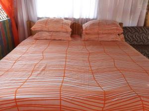 Postel nebo postele na pokoji v ubytování Beachaus Resort