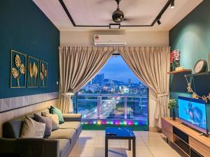 a living room with a couch and a large window at KL One Residence by Nest Home [Infinity Pool & KL Skyline] in Kuala Lumpur