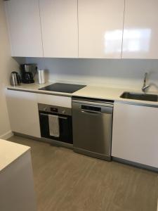 A kitchen or kitchenette at Duna Beach - Infinity Pool