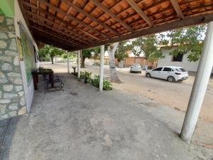 an outside view of a building with a car parked at Pousada Marlene in Barreirinhas