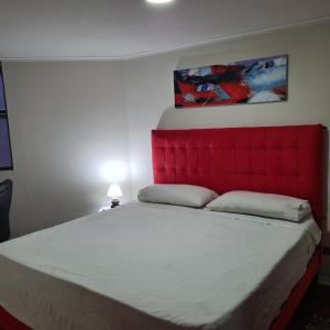 Postel nebo postele na pokoji v ubytování San Andres Suite Apartments