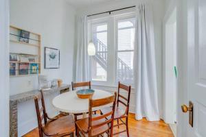 a dining room with a table and chairs and a window at Apartment on Broadway in Nashville