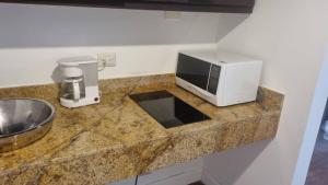 Η κουζίνα ή μικρή κουζίνα στο CCCT ApartaHotel Ccct