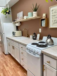 a kitchen with a stove and a white refrigerator at Everything you could ask for in a Rental in Nashville