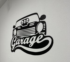 a sticker of a car garage on a wall at ESI Apartments #Central in Timişoara