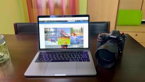 a laptop computer sitting on a table with a camera at Castle Maisonette in Chios