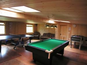 a billiard room with two ping pong tables at Duddings Country Cottages in Minehead