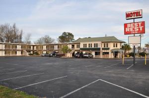 a parking lot in front of a motel with a sign at Best Rest Inn - Jacksonville in Jacksonville +6 photos