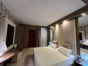 Postel nebo postele na pokoji v ubytování Hotel Lafayette