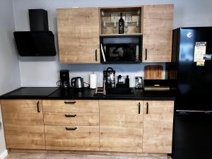 Kuchyňa alebo kuchynka v ubytovaní Apartamenty Czarna Perła