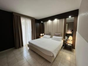 Postel nebo postele na pokoji v ubytování Hotel Lafayette