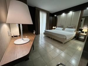 Postel nebo postele na pokoji v ubytování Hotel Lafayette