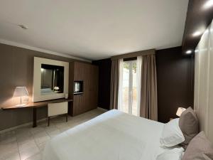 Postel nebo postele na pokoji v ubytování Hotel Lafayette