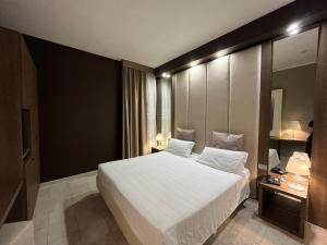 Postel nebo postele na pokoji v ubytování Hotel Lafayette