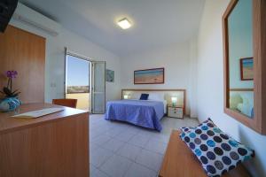 Ένα ή περισσότερα κρεβάτια σε δωμάτιο στο Hotel Damanse