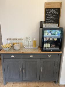 a gray cabinet with food on top of it at Summer Breeze Guest House in Newquay