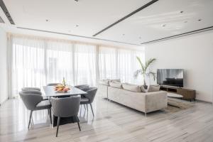a living room with a table and a couch at 360 Nicosia-3 bedrooms Exclusive Panoramic View Residence in Nicosia