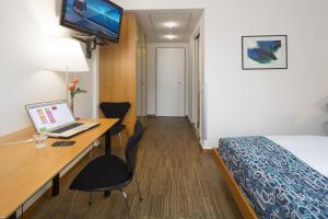 TV a/nebo společenská místnost v ubytování Business & Art Hotel Markgraf