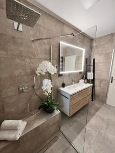 a bathroom with a sink and a mirror at Fantastic villa in the bay of Cannes, 5 minutes from the beach - with private pool in Mandelieu-la-Napoule