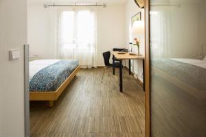 Postel nebo postele na pokoji v ubytování Business & Art Hotel Markgraf