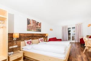 Rúm í herbergi á Hotel Gasthof Weiherbad