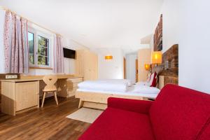 Rúm í herbergi á Hotel Gasthof Weiherbad