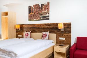 Rúm í herbergi á Hotel Gasthof Weiherbad