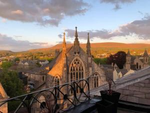 a church with a view of a city at Boutique penthouse apartment with rooftop terrace in Clitheroe