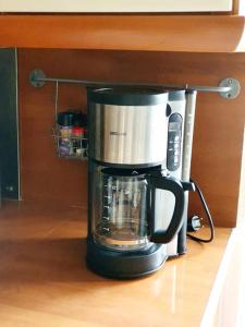 a coffeemaker sitting on a kitchen counter at Demeure de charme paisible in Villepinte