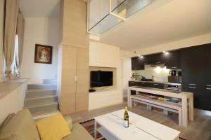 a living room with a couch and a table at Duplex lumineux et spacieux in Nice