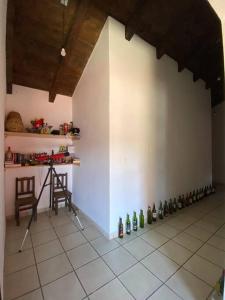 a room with a bunch of wine bottles on the floor at Happy Place in San Cristóbal de Las Casas