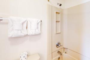 a bathroom with white towels hanging on the wall at Timber Run Vista 2 in Winter Park +7 photos