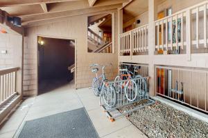 two bikes parked on the side of a building at Timber Run Vista 2 in Winter Park
