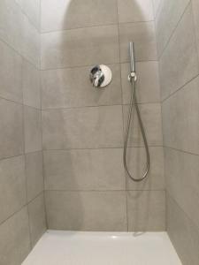 a shower with a shower head in a bathroom at Suite Florio in Turin +39 photos
