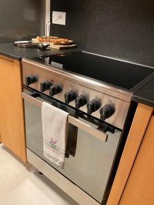 A kitchen or kitchenette at Attico Vista Tofane