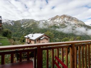 a balcony with a view of a mountain at Chalet de charme à Saint Marcel, 4 chambres, 10 pers, proche navette ski, label 5 flocons Or - FR-1-570-18 in Saint-Marcel