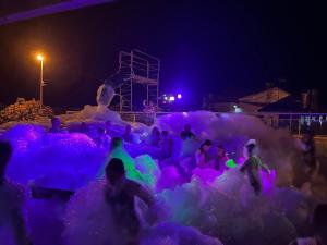 a group of people playing in an ice castle at night at Mobil Home à Meschers au camping l'Escale proche de Royan in Meschers-sur-Gironde