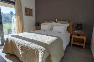 Uma cama ou camas num quarto em Laje da Bica Agroturismo