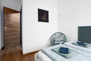 Posteľ alebo postele v izbe v ubytovaní Nightingale Luxury Apartment