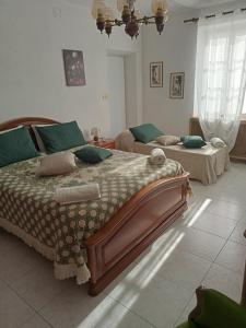 מיטה או מיטות בחדר ב-Casa Bruna