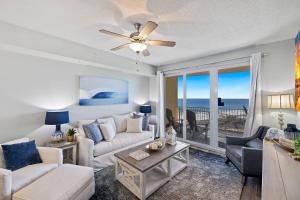 a living room with a couch and a table at Beach N View Calypso 3 in Panama City Beach