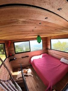 an overhead view of a bed in a room with windows at Alto Luciérnaga 