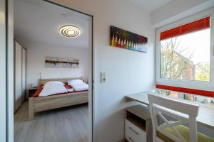 Postel nebo postele na pokoji v ubytování Nordland Appartements - Wohnung Pellworm + 38 fotografií