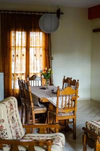 a dining room with a table and chairs at Traditional cozy residence in Lafkos, Pelion in Lafkos