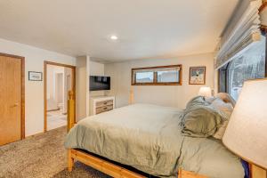 a bedroom with a large bed and a window at Donner Lake House in Truckee