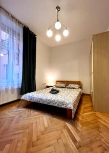 Postel nebo postele na pokoji v ubytování Starowiślna st Apartment