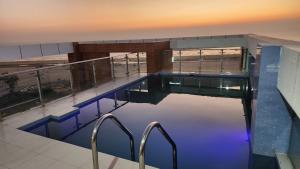 a swimming pool on top of a building at Hotel Cox Rotana in Cox's Bazar